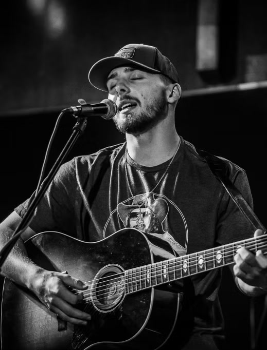 Kalen Mxrcus singing, black and white portrait